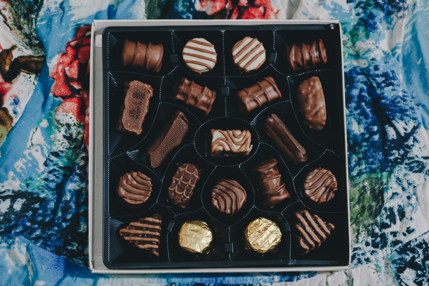 An assortment of chocolate bonbons arranged in a box